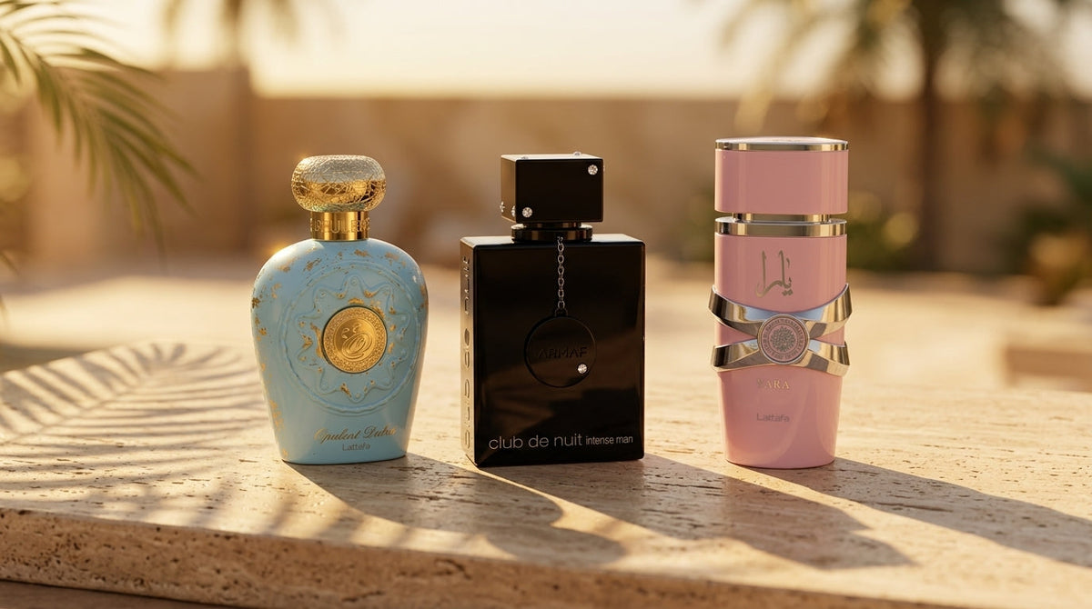 Lattafa Opulent Dubai, Armaf Club de Nuit Intense Man, and Lattafa Yara perfume bottles displayed together on a warm stone surface in golden light