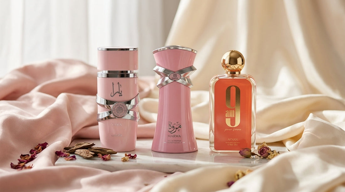 Lattafa Yara, Emper Marwa, and Afnan 9AM Pour Femme perfumes displayed together on draped silk in blush and ivory tones