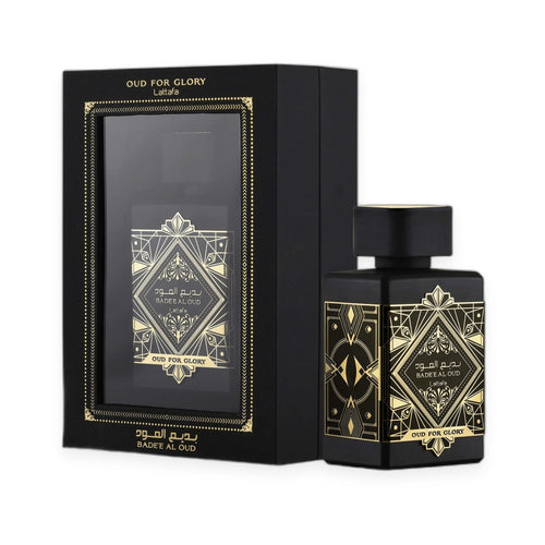 Black glass bottle and matching black box of Bade'e Al Oud Oud for Glory by Lattafa, featuring gold geometric and diamond-sha