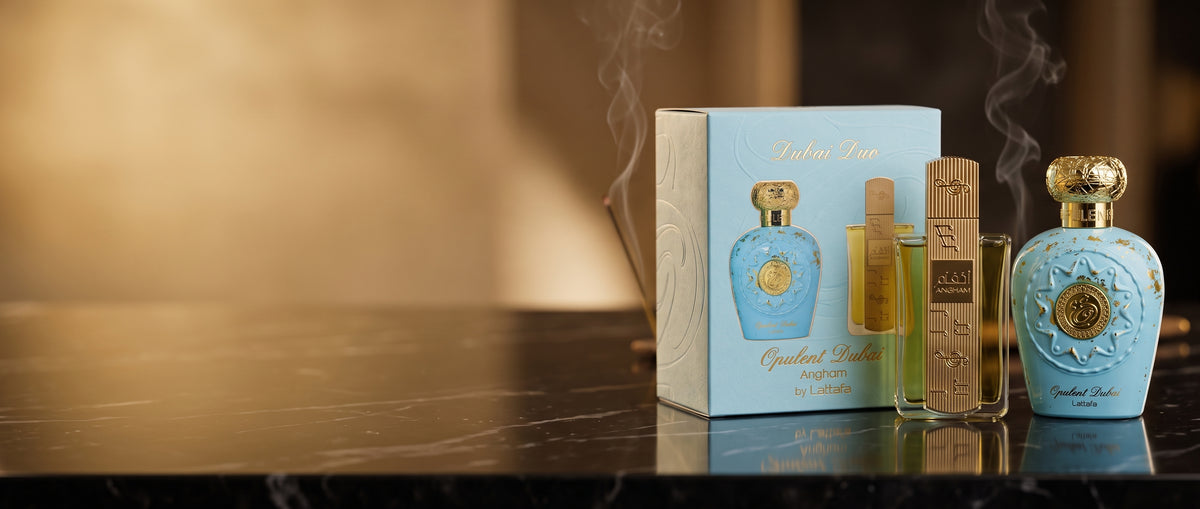 Dubai Duo bundle featuring Opulent Dubai and Angham by Lattafa perfume bottles displayed together in luxury packaging on dark marble with golden lighting